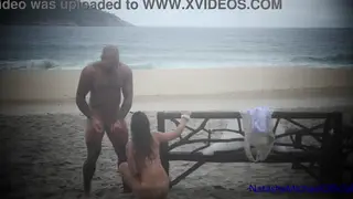 Curvy Brunette Takes Her Husband on a Public Beach