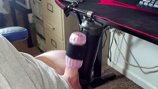 Slender Guy Uses Toy on Desk While Partner Watches