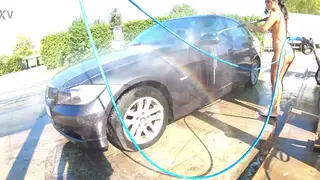 Curvy Lesbians Get Wet Beside a Car Outdoors