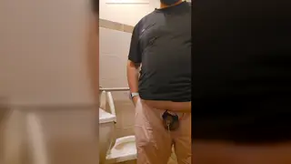 Hairy Latino Bear Pisses at a Public Urinal