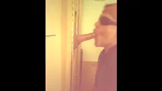 Redhead Leads a Gloryhole Gangbang and Orgy