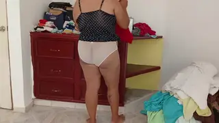 Curvy Woman Tidies Up While Partner Watches Closely
