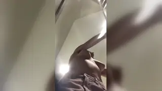 Busty Tattooed MILF Reveals All in a Station