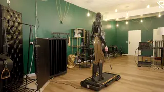 Masked Submissive Endures Latex Bondage on a Treadmill