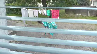 Brunette MILF Flashes Naked Body to Voyeur Neighbor in Courtyard