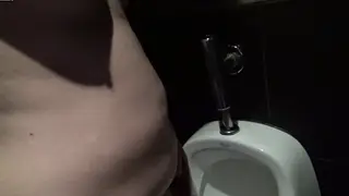 European Chub Pisses Slowly at Cinema Urinal