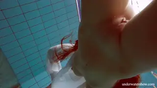 Redhead Teen Shows Off Busty Figure Underwater