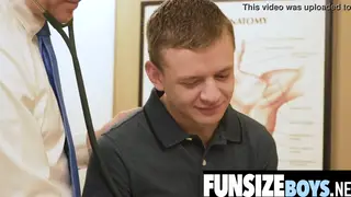 Doctor Examines Teen Patient in Hospital Uniform