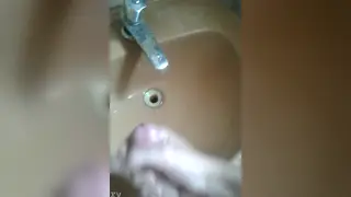 Solo Guy Finishes on the Sink During a Quick Bathroom Break