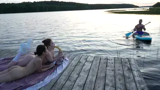 Three Amateurs Share a Surfer on a Public Beach