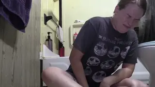 Voluptuous Woman Rims Partner on Bathroom Floor