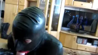 Rubber-Clad Sub Serves His Master's Cock in Bondage