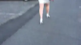 Mature MILF Shows Off Curves in White Mini Dress
