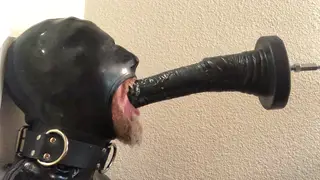 Rubber Sub Endures Machine Throat Fucking