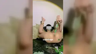 Asian Femboy in Cosplay Plays with Toys Outdoors