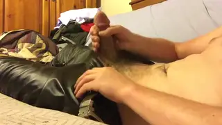 Leather-Clad Stud Strokes a Load Onto His Pants