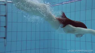 Redhead Petite Babe Swims Naked in Outdoor Pool