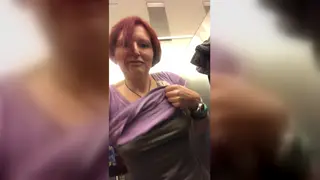 Redhead MILF Bares Breasts Before Airport Piss