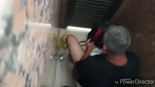Mature Man Relieves Himself in a Public Indoor Space