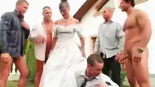 Bride Surrounded by Men Outdoors for Multiple Facials