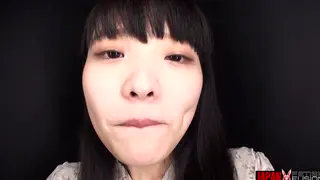 Asian Teen Shows Off Tongue and Mouth in Extreme Close-up