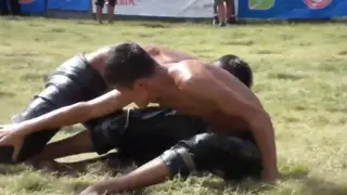 Middle Eastern Wrestlers Grapple in Oil