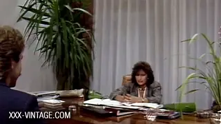 Brunette Casting Producer Auditions Employee at Office Desk