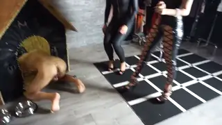 European Dominatrices Control Submissive Slave in Femdom Scene