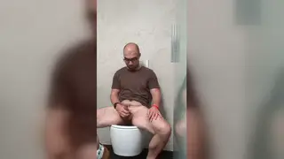 Mature Daddy Strokes a Thick Load in the Office Bathroom