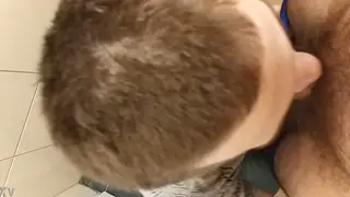 Guy Gives Deep Blowjob in a Public Restroom