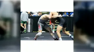 Coach and Athlete Grapple in a Steamy Gym Showdown